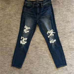 American eagle dark blue distressed jeans.
